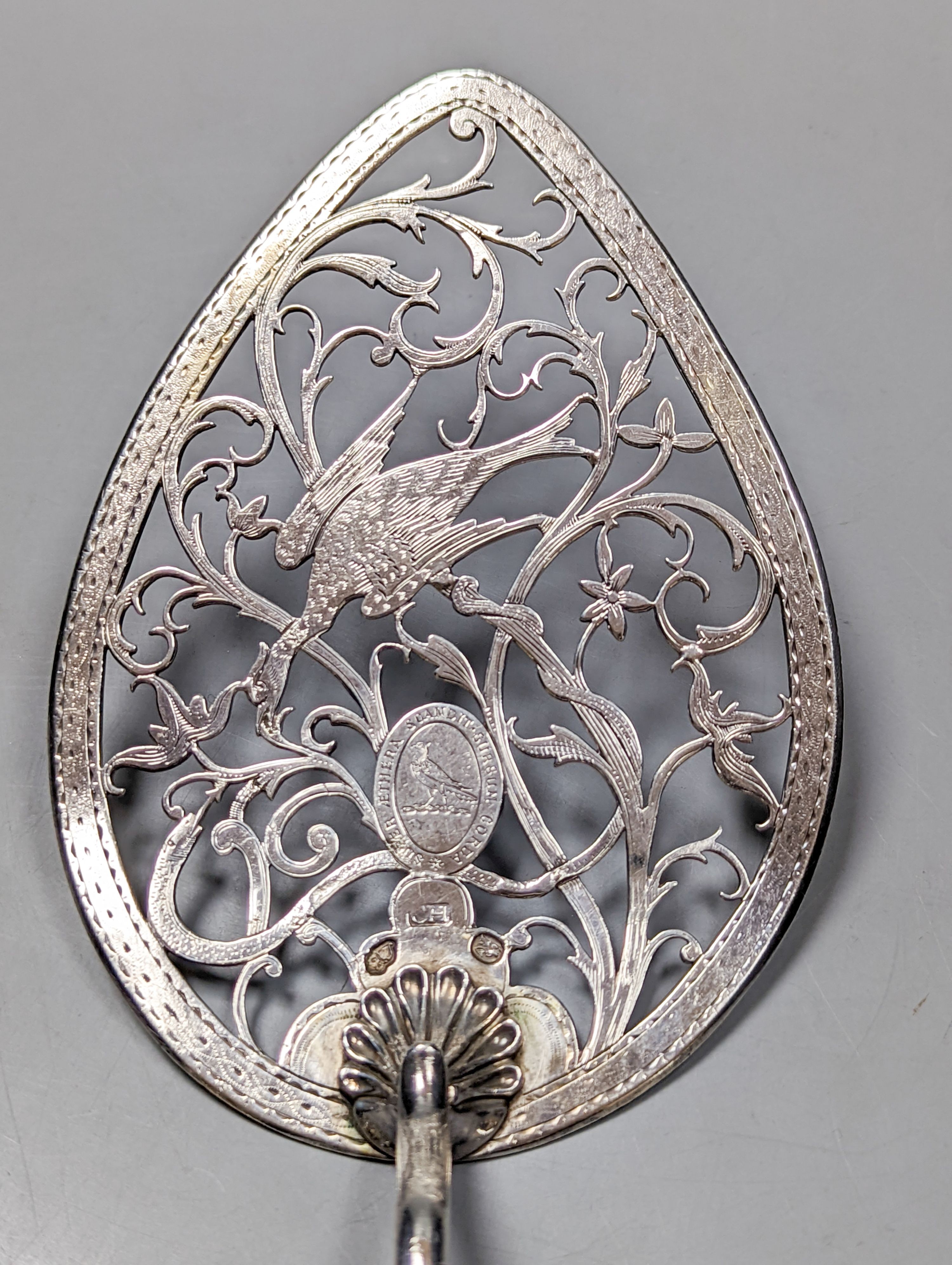 A George III Irish ivory handled pierced silver cake slice, Christopher Haines, Dublin, circa, 1790, 29.1cm, gross 4.5oz.